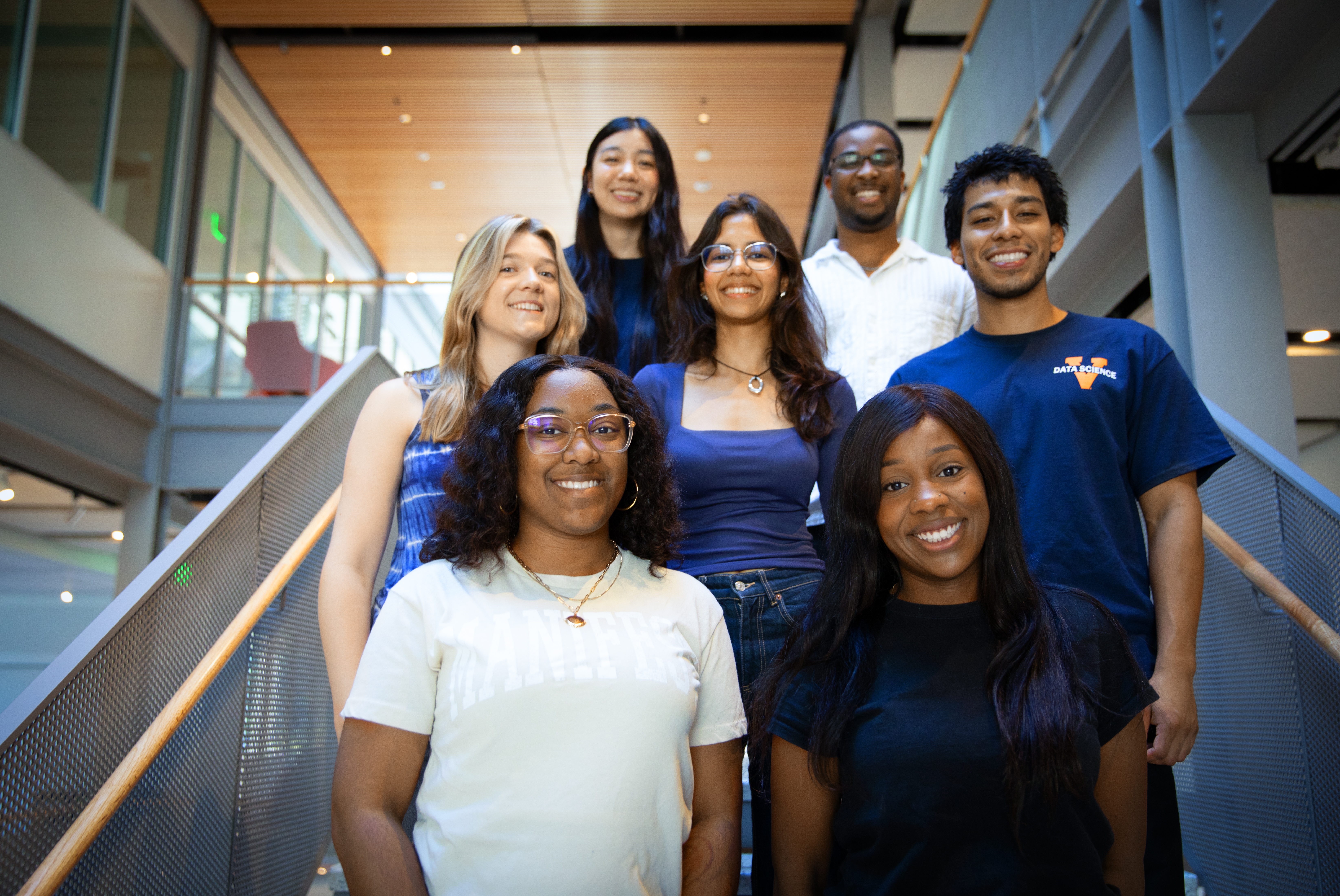 UVA Data Science MSDS student ambassadors gathered together on stairs for a group photo