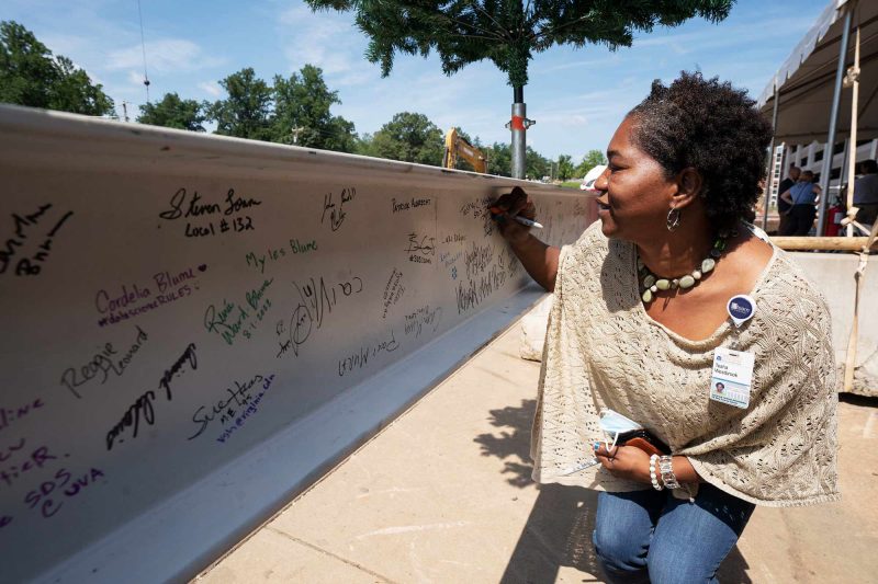 Tesha signs beam